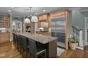 Spacious kitchen features a large island, stainless appliances, and hardwood floors at 1501 Samuel Wait Ln, Wake Forest, NC 27587