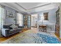 Comfortable living room featuring hardwood floors, modern sofa, and decorative touches at 170 Homestead Rd, Angier, NC 27501