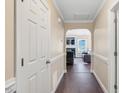 Inviting hallway with hardwood floors leads to a comfortable living area with natural light at 1826 Heisser Ln, Fuquay Varina, NC 27526