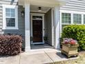 Inviting front porch with decorative planters and well-maintained landscaping at 1909 Whirlaway Ct., Cary, NC 27519