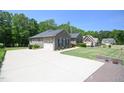 View of the home's driveway and attached two-car garage at 197 W Paige Wynd Dr, Angier, NC 27501