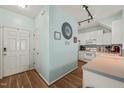 Cozy kitchen with white cabinets, hardwood floors, and modern appliances, creating a warm atmosphere at 2105 Metacomet Way, Raleigh, NC 27604