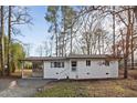 A charming one-story brick home with a screened-in carport and lovely curb appeal at 2224 Clements Dr, Durham, NC 27704