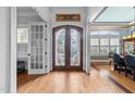 Elegant foyer boasting hardwood floors and a beautiful stained glass double front door at 2820 Charleston Oaks Dr, Raleigh, NC 27614