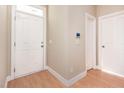Bright foyer with tile flooring, showcasing the entryway and access to other rooms at 300 Sugar Maple Ave, Wake Forest, NC 27587