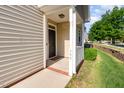 Inviting covered front porch features classic details and a welcoming entrance to the home at 300 Sugar Maple Ave, Wake Forest, NC 27587