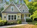 Inviting two-story home featuring stone accents, a cozy front porch, and abundant natural light throughout at 3650 Brooks Bnd, Franklinton, NC 27525