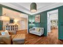 Inviting living room with hardwood floors, stylish decor, and a view to the kitchen at 3650 Brooks Bnd, Franklinton, NC 27525