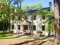 Inviting two-story house with shutters, complemented by lush landscaping at 3838 Regent Rd, Durham, NC 27707
