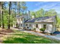 Charming two-story white home with shutters and a well-maintained lawn at 3838 Regent Rd, Durham, NC 27707