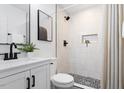 Modern bathroom with a glass-enclosed shower, sleek vanity, and stylish fixtures at 3907 Inwood Dr, Durham, NC 27705