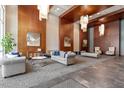 Grand lobby with high ceilings, elegant seating, wood paneling, and stylish decor at 400 W North St # 1430, Raleigh, NC 27603