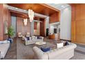 Stylish lobby featuring high ceilings, hardwood decor, elegant seating arrangements, and modern lighting at 400 W North St # 1430, Raleigh, NC 27603