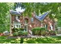 Beautiful brick home with lush green lawn and mature landscaping in a desirable neighborhood at 5 Burgess Ct, Hillsborough, NC 27278