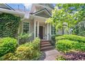 Welcoming front entrance with brick steps and manicured bushes, leading to front door at 51 Abernathy Dr, Chapel Hill, NC 27517