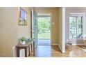 Bright entryway featuring hardwood floors, a console table, and a view of the outdoors at 5319 Memory Ln, Durham, NC 27712