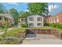 View of a cozy home featuring a quaint front porch and manicured front yard at 623 Massey Ave, Durham, NC 27701
