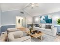 Cozy living room with neutral-toned furniture, large windows, and stylish decor at 6820 Chamonix Pl, Raleigh, NC 27613