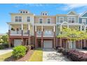 Inviting townhome exteriors featuring colorful facades, classic porches, and well-maintained landscaping at 710 Samuel Cary Dr, Cary, NC 27511