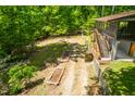 A spacious backyard with wooded surroundings is perfect for outdoor enjoyment at 7723 Johnson Mill Rd, Bahama, NC 27503