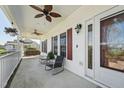 Inviting front porch with ceiling fans, seating, and decorative accents, perfect for relaxing outdoors at 79 Blande Dr, Kenly, NC 27542