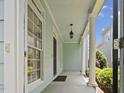 Inviting front porch with classic columns and ample space for outdoor relaxation at 815 Carpenter Town Ln, Cary, NC 27519