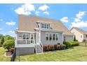 Well-maintained backyard featuring a deck and lush green lawn at 10 Princeton Manor Dr, Youngsville, NC 27596