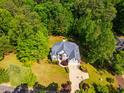 Gorgeous aerial view of manicured lawns and stunning traditional architecture at 100 Panoramic Ct, Cary, NC 27519
