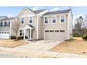 Traditional two-story house with a two-car garage, and inviting front entrance at 1012 Old Evergreen Dr, Durham, NC 27704