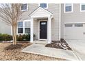 Welcoming front entrance with a stylish black door and covered porch at 1012 Old Evergreen Dr, Durham, NC 27704
