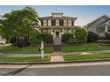 Charming two-story home with a welcoming front porch and professionally landscaped front yard at 112 Homegate Cir, Apex, NC 27502