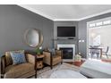Cozy living room with a fireplace, comfortable seating, and elegant decor at 112 Homegate Cir, Apex, NC 27502