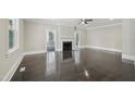 Bright living room featuring gleaming hardwood floors, a decorative fireplace, and neutral paint at 1331 Sunset Ave, Rocky Mount, NC 27804
