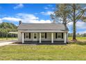 Charming home featuring a classic covered porch at 1347 Crocker Rd, Smithfield, NC 27577