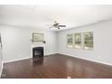 Spacious living room featuring hardwood floors, fireplace and large windows at 163 Davelyn Ct, Garner, NC 27529