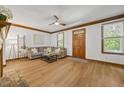 Bright living room boasts a cozy fireplace, wood floors, and stylish furniture for a relaxing atmosphere at 1806 Carrington Dr, Raleigh, NC 27615