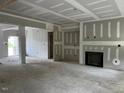 Bright living room featuring unfinished walls, fireplace and entryway to other parts of the house at 196 Cozy Brook Ct, Clayton, NC 27520