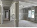 View of a light-filled room under construction with painted columns and walls at 196 Cozy Brook Ct, Clayton, NC 27520