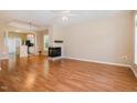 Open concept living space featuring hardwood floors, a fireplace, and seamless access to the kitchen at 209 Mccarthy Dr, Clayton, NC 27527