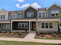 Attractive townhome exterior with colorful accents, well-maintained landscaping, and an inviting entrance at 2917 Alyssa Ct, Knightdale, NC 27604