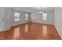 This cozy living room boasts gleaming hardwood floors and a delightful ambiance at 3069 Buttonwood Ln, Clayton, NC 27520