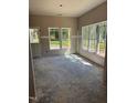 Sunlit room featuring a door and two large windows, allowing for ample light and views at 337 Green Pines Estates Dr, Kenly, NC 27542