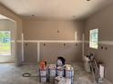 Spacious room in construction phase featuring newly installed sheetrock and dual windows at 337 Green Pines Estates Dr, Kenly, NC 27542