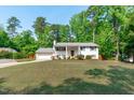 Inviting two-story home with a lush front yard, offering classic design and curb appeal at 4109 Huckleberry Dr, Raleigh, NC 27612