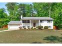 Beautiful brick home featuring a well-manicured lawn, neutral color scheme, and an attached garage at 4109 Huckleberry Dr, Raleigh, NC 27612