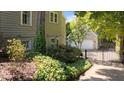 Secluded backyard with lush greenery, gated access and a detached two-car garage for added convenience at 518 S Main St, Wake Forest, NC 27587