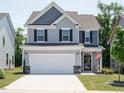 Beautiful two-story home featuring a spacious driveway and a well-kept lawn at 555 Whitley Ridge Dr, Clayton, NC 27527