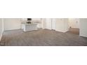 Open floor plan featuring modern flooring and a view of the white kitchen with an island at 6036 Sodium St, Raleigh, NC 27610