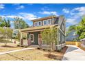 Beautiful home featuring a well-kept lawn, concrete drive, and inviting front porch at 801 N Elm St, Durham, NC 27701