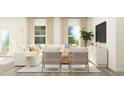 Inviting living room with a plush sofa, cozy seating, and abundant natural light from large windows at 00 Hanover Dr, Sanford, NC 27330
